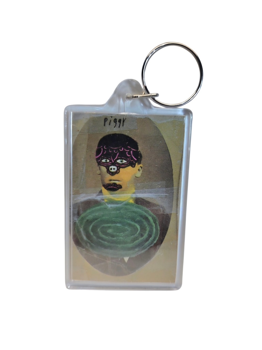 Keychain featuring a surreal collage portrait of a masked figure